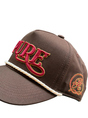 Brown cap with red 'PURE' logo and white brim on a gray background