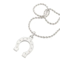 A silver horseshoe pendant necklace with small star engravings, shown on a matching twisted chain against a plain white background.