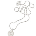 A silver-toned necklace with a round pendant featuring a starburst design, displayed on a clean white background with a price label of $164 below.